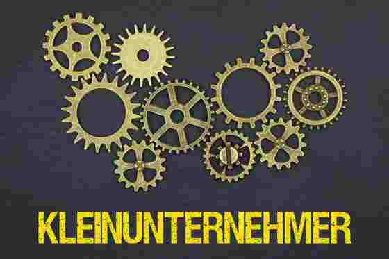 Zahnräder und Schriftzug Kleinunternehmer